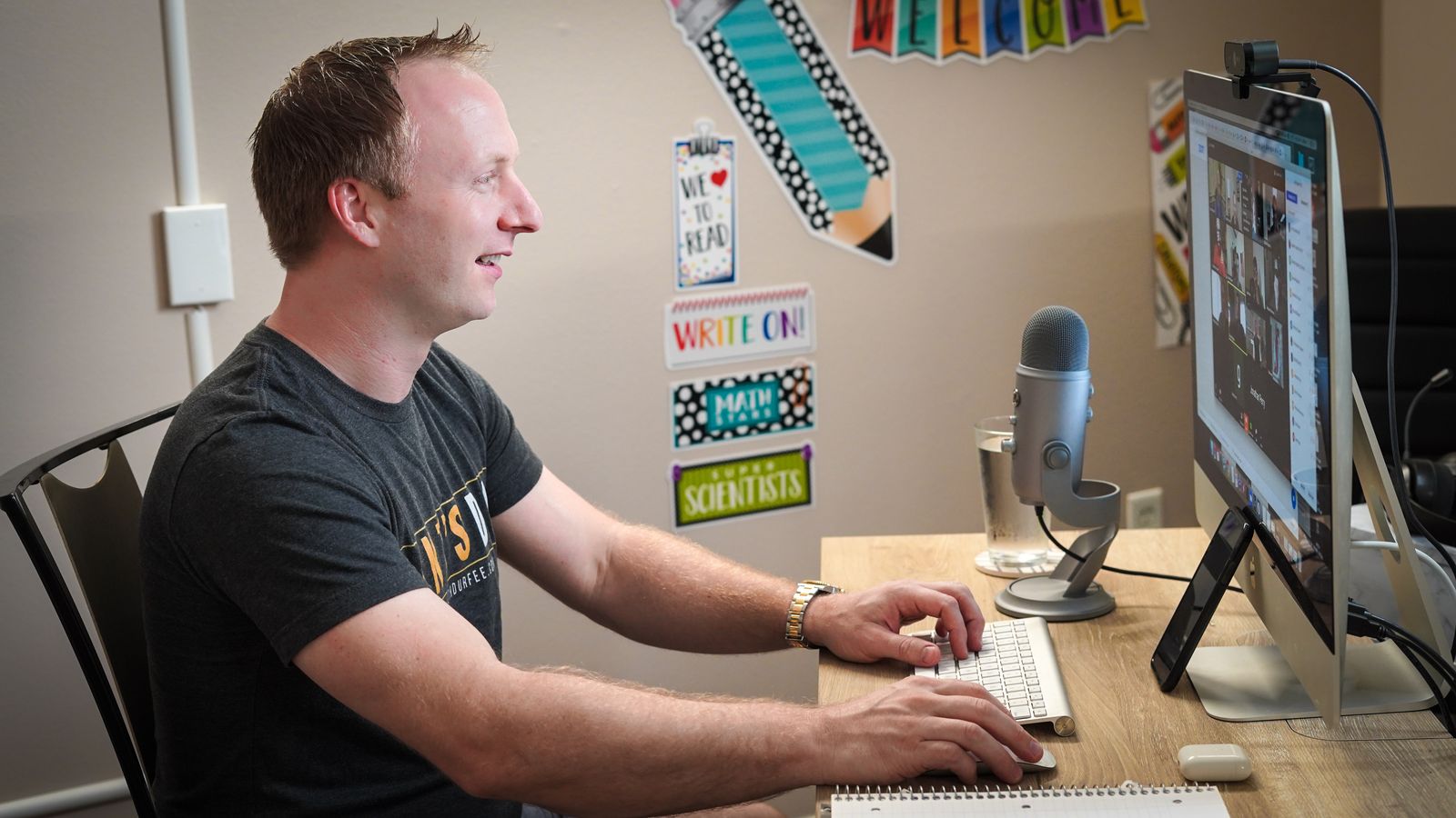 Advertising coordinator at a workstation planning a placement schedule