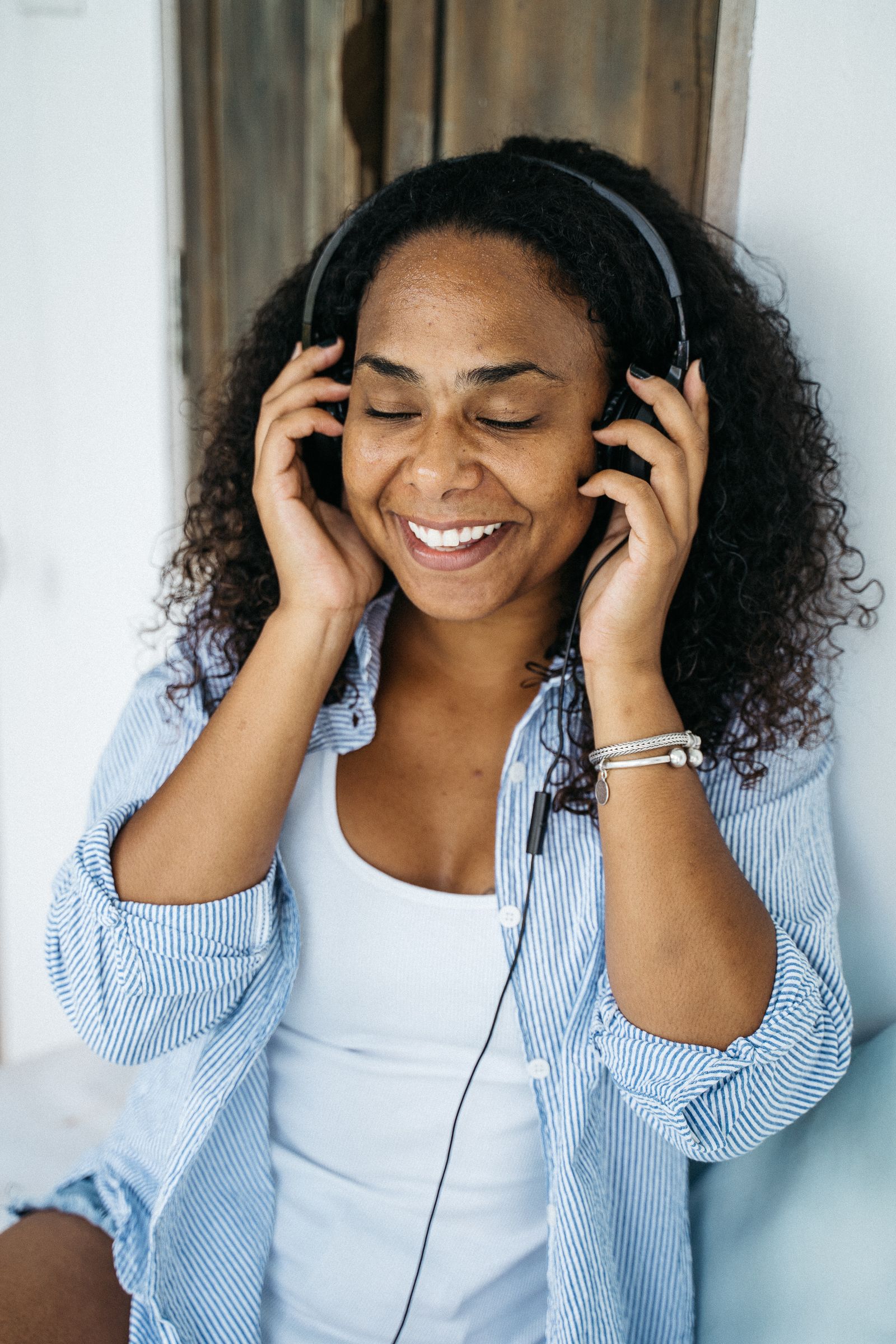 Host recording a podcast segment at a microphone